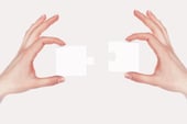 Image of colour puzzle pieces and human hand