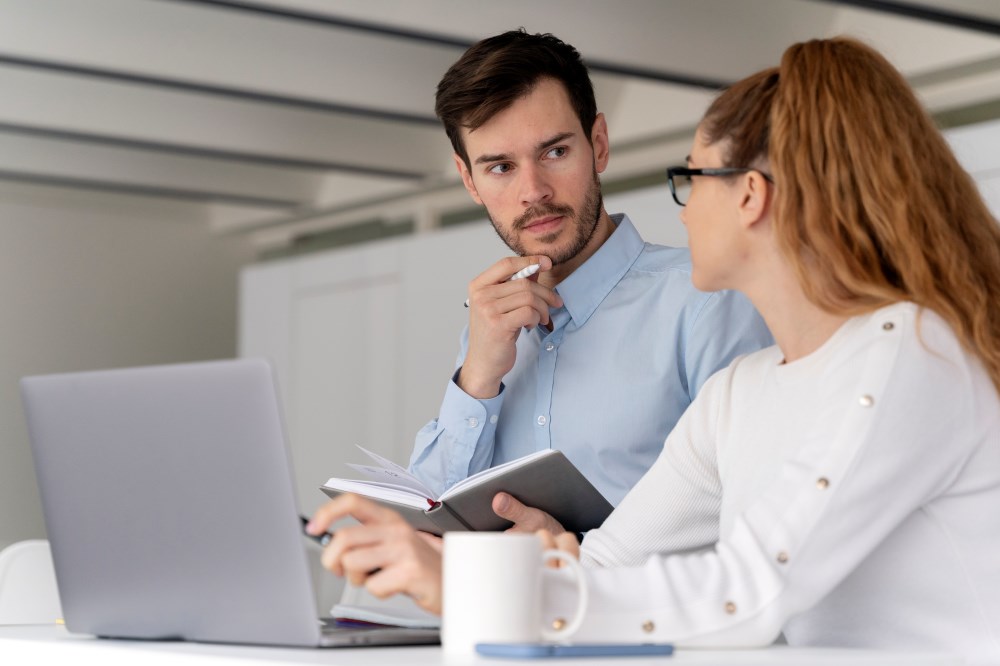 young-business-team-working-together-office